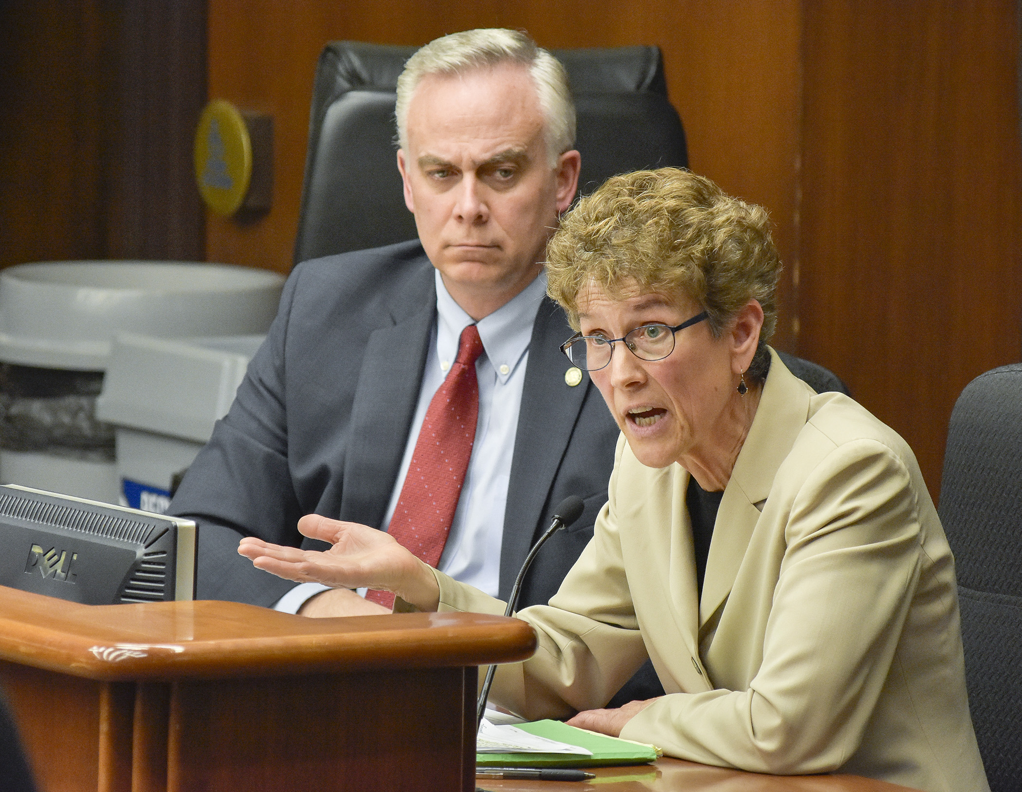 Anne Henry, staff attorney at the Disability Law Center, testifies before the House Health and Human Services Finance Committee April 13 in support of a bill sponsored by Rep. Tony Albright, left, that would modify spousal anti-impoverishment provisions. Photo by Andrew VonBank